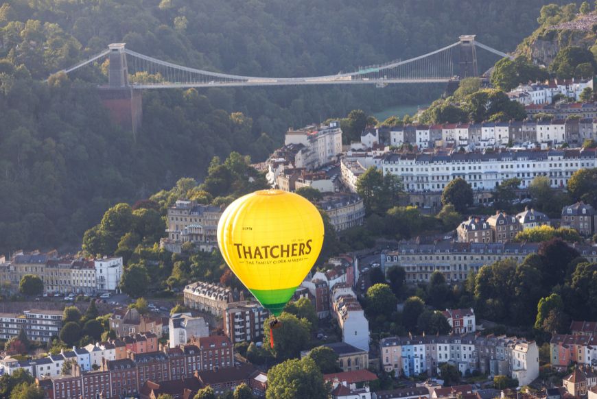 Thatchers hot air balloon infront of the Clifton Suspension Bridge